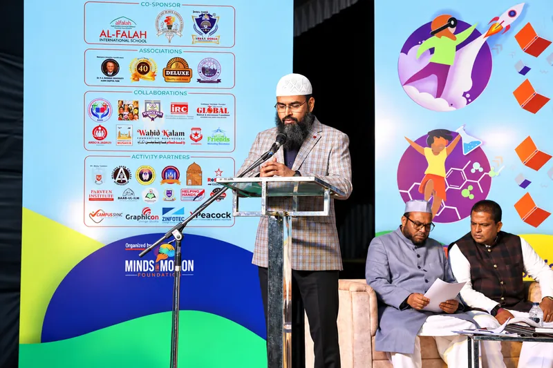 Formal Education Conference Stage with Speaker and Attendees